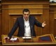 Tsipras defies protesters, austerity measures pass