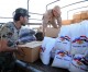 Russia delivers humanitarian aid to trapped Syrians