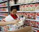 China imposes record fines on dairy firms for high-pricing
