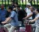 China to ease restrictions on suing government